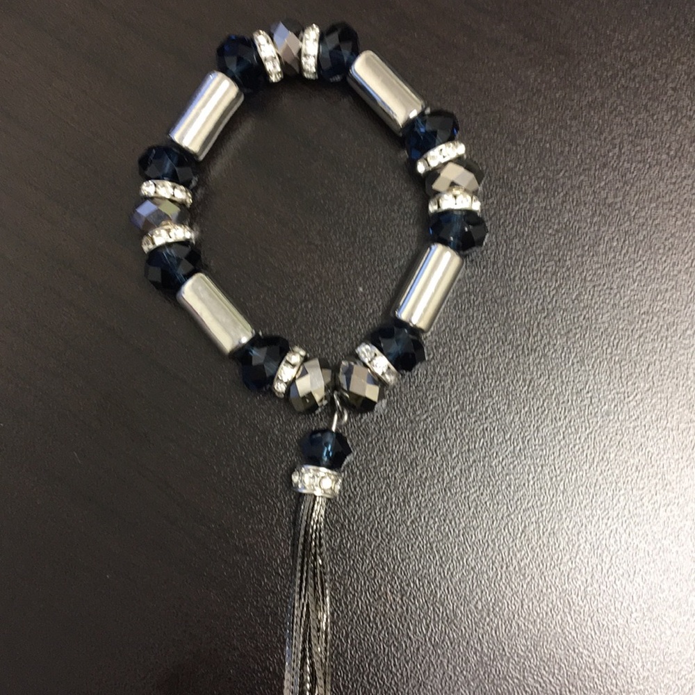 Silver and navy blue bead bracelet with tassel